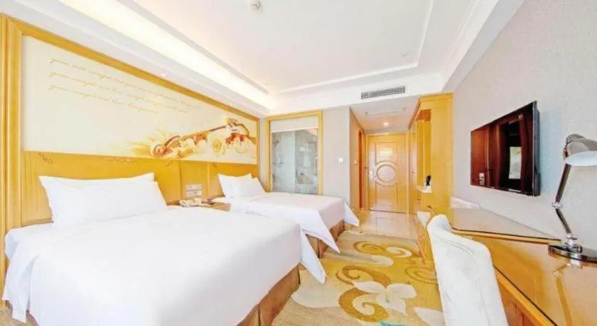 Bed in Vienna Hotel Guangdong Zhongshan Ancient Town Haizhou