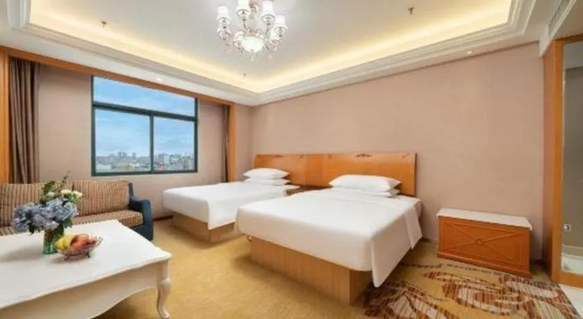 Bed in Vienna Hotel Nanning Anji Wanda 33rd Middle School Metro Station
