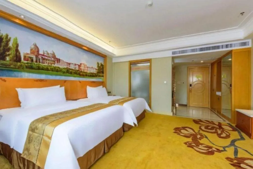 Bed in Vienna Hotel Nanning Anji Wanda 33rd Middle School Metro Station
