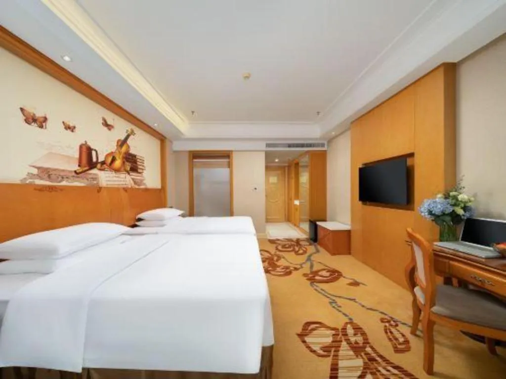 Bed in Vienna Hotel Nanning Anji Wanda 33rd Middle School Metro Station