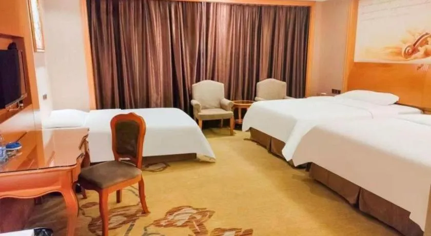 Bed in Vienna Hotel Nanning Anji Wanda 33rd Middle School Metro Station