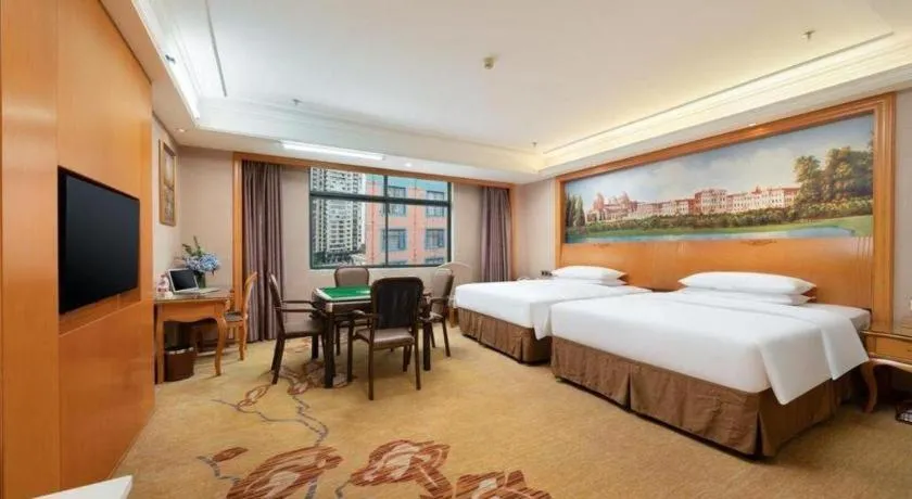 Bed in Vienna Hotel Nanning Anji Wanda 33rd Middle School Metro Station