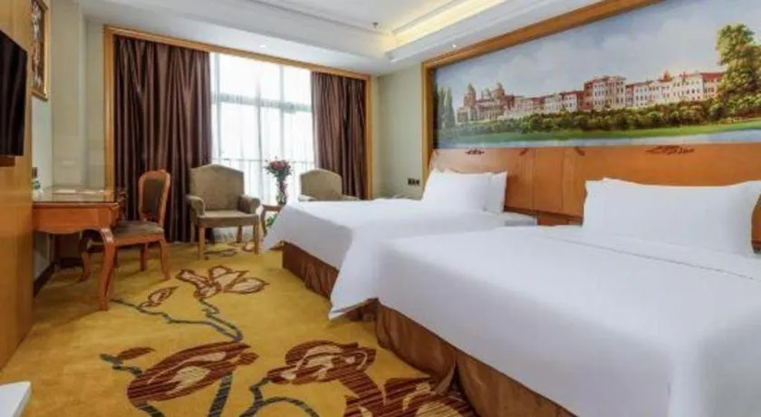 Bed in Vienna Hotel Nanning Anji Wanda 33rd Middle School Metro Station