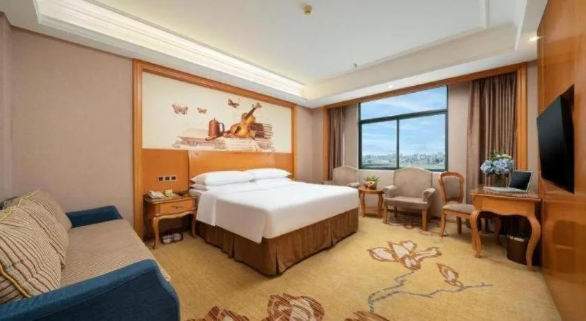 Bed in Vienna Hotel Nanning Anji Wanda 33rd Middle School Metro Station