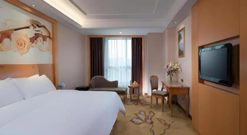 Bed in Vienna Hotel Nanning Anji Wanda 33rd Middle School Metro Station