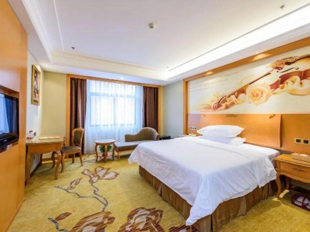 Bed in Vienna Hotel Nanning Anji Wanda 33rd Middle School Metro Station