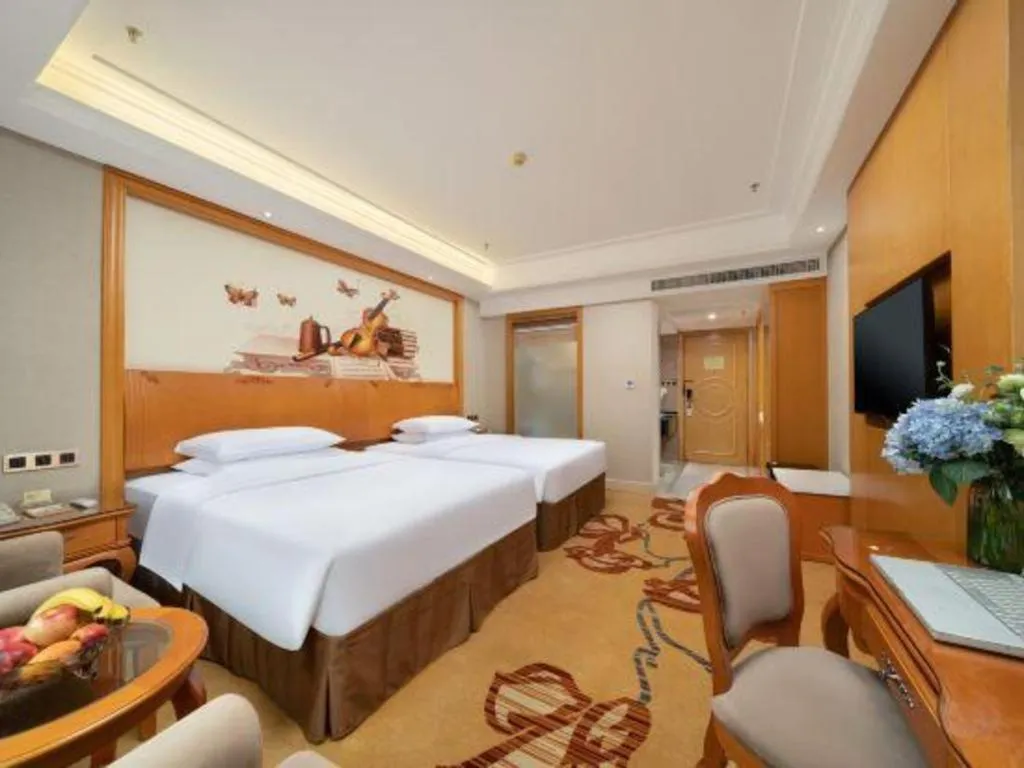 Bed in Vienna Hotel Nanning Anji Wanda 33rd Middle School Metro Station