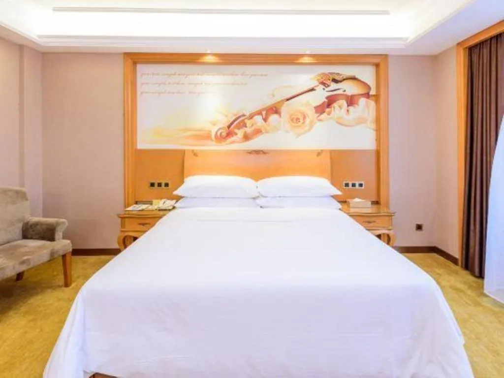 Bed in Vienna Hotel Nanning Anji Wanda 33rd Middle School Metro Station
