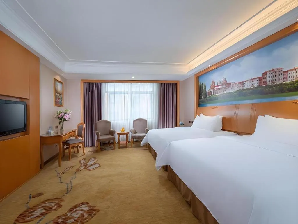 Bed in Vienna Hotel Nanning Anji Wanda 33rd Middle School Metro Station