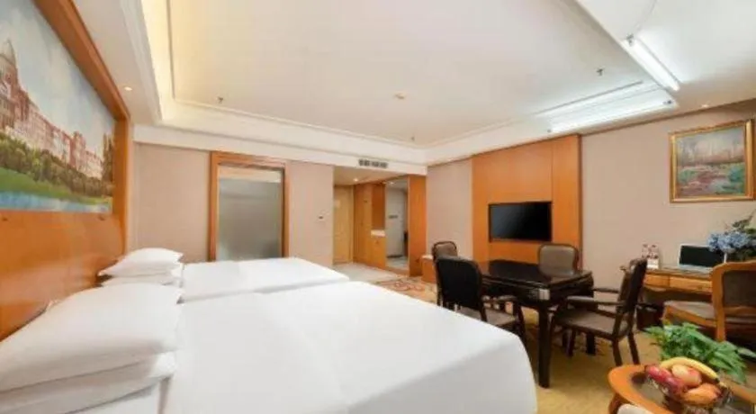 Bed in Vienna Hotel Nanning Anji Wanda 33rd Middle School Metro Station