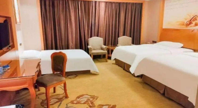 Bed in Vienna Hotel Nanning Anji Wanda 33rd Middle School Metro Station