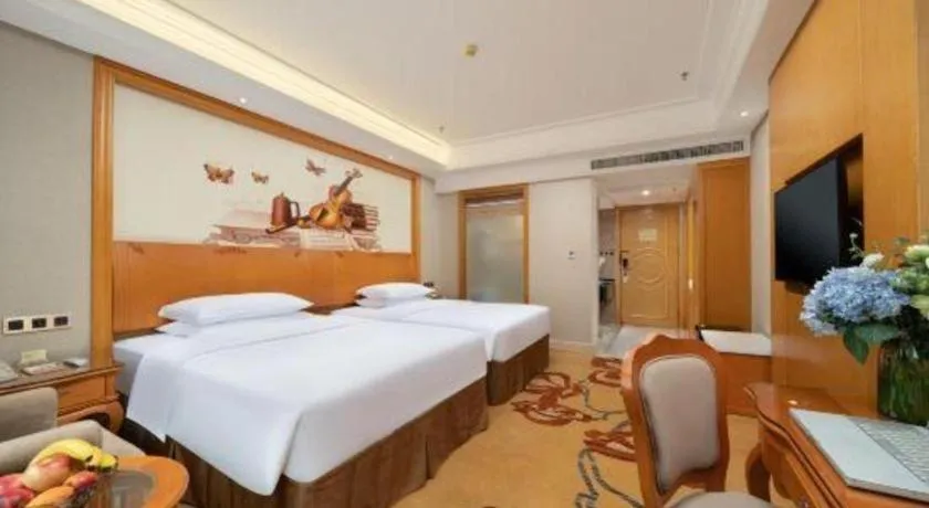 Bed in Vienna Hotel Nanning Anji Wanda 33rd Middle School Metro Station