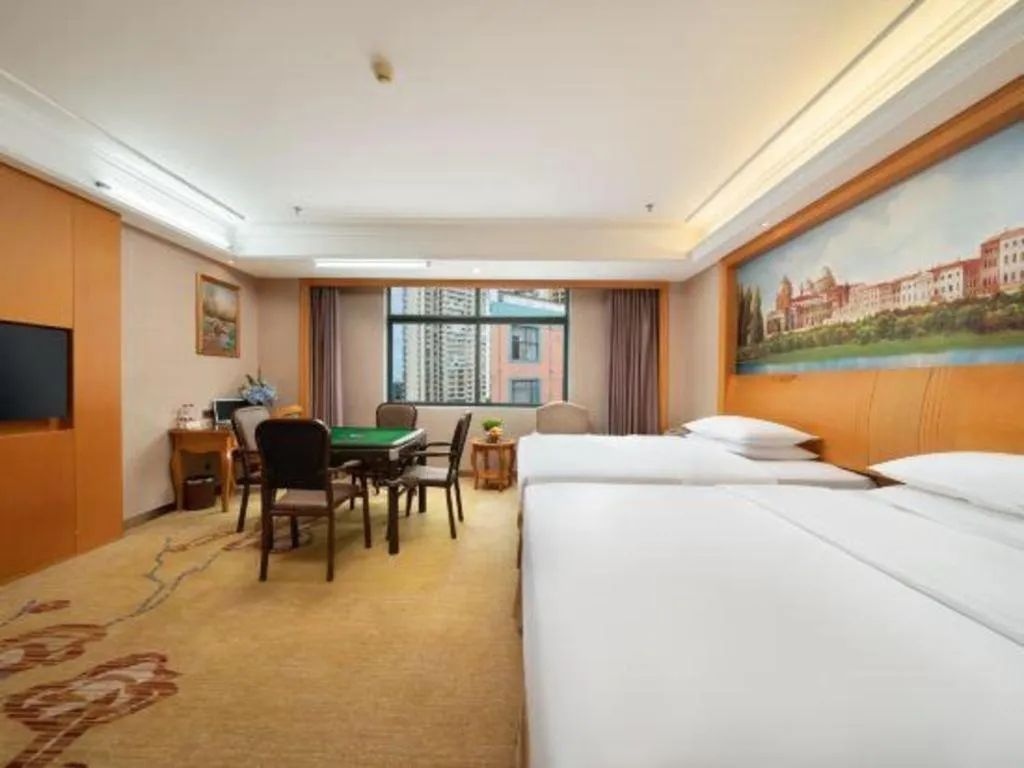 Bed in Vienna Hotel Nanning Anji Wanda 33rd Middle School Metro Station