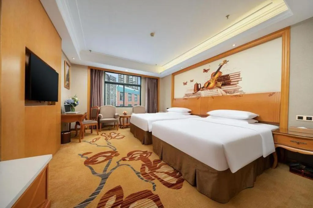 Bed in Vienna Hotel Nanning Anji Wanda 33rd Middle School Metro Station