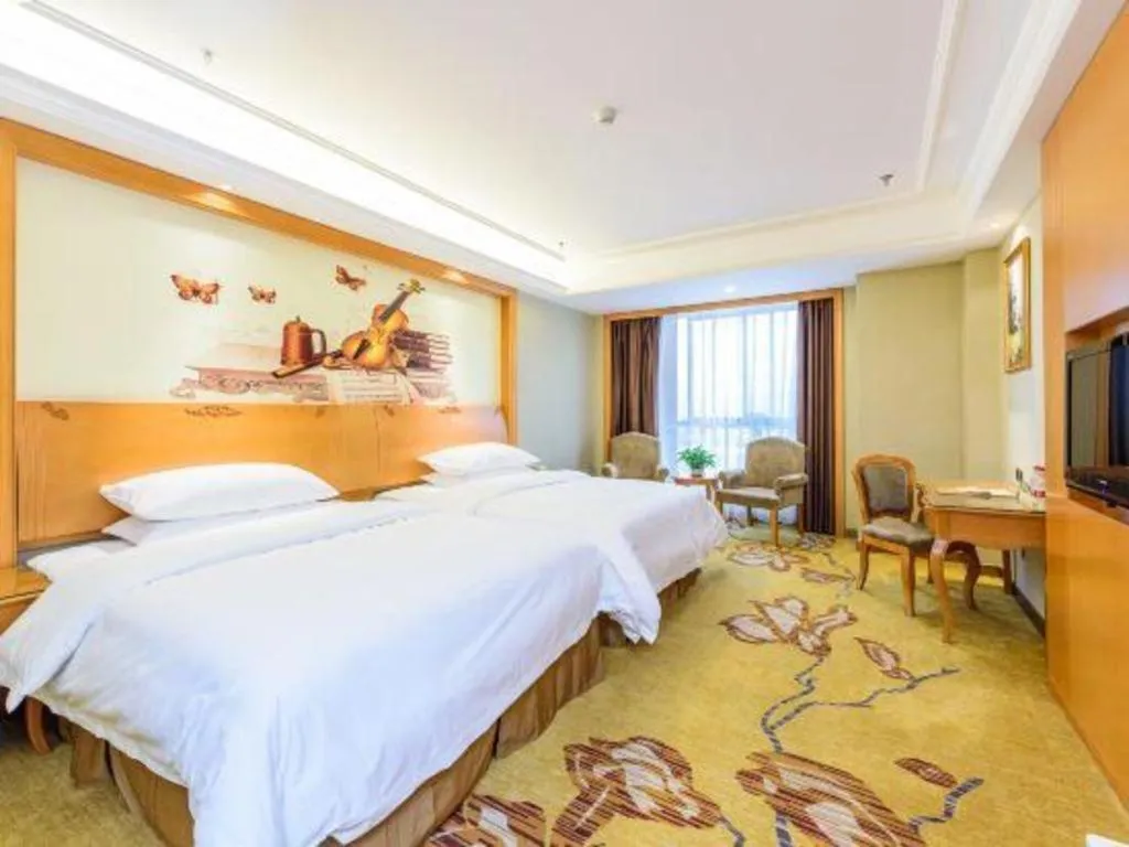 Bed in Vienna Hotel Nanning Anji Wanda 33rd Middle School Metro Station