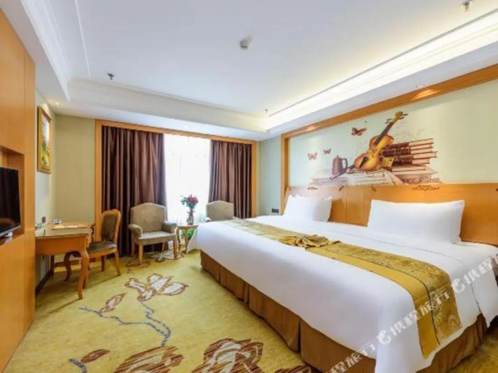 Bed in Vienna Hotel Nanning Anji Wanda 33rd Middle School Metro Station