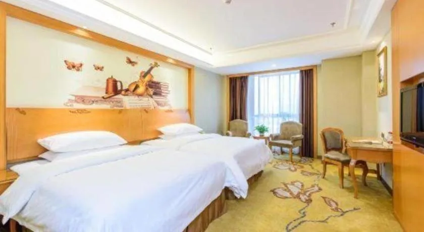 Bed in Vienna Hotel Nanning Anji Wanda 33rd Middle School Metro Station