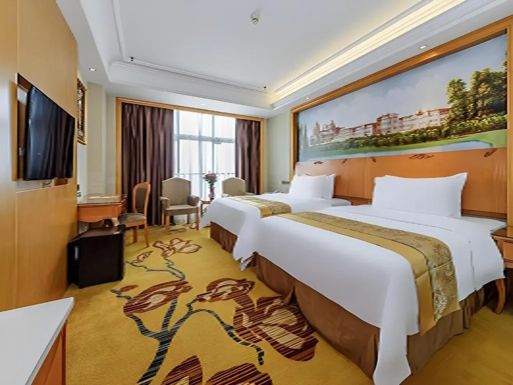 Bed in Vienna Hotel Nanning Anji Wanda 33rd Middle School Metro Station