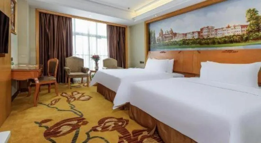 Bed in Vienna Hotel Nanning Anji Wanda 33rd Middle School Metro Station