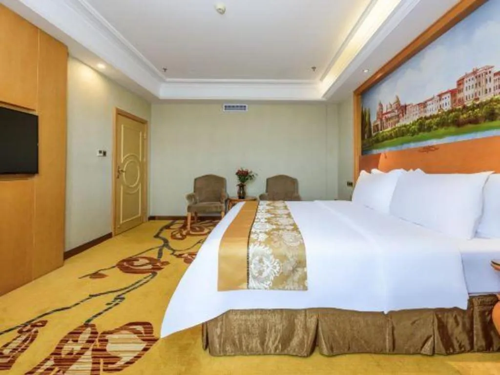 Bed in Vienna Hotel Nanning Anji Wanda 33rd Middle School Metro Station