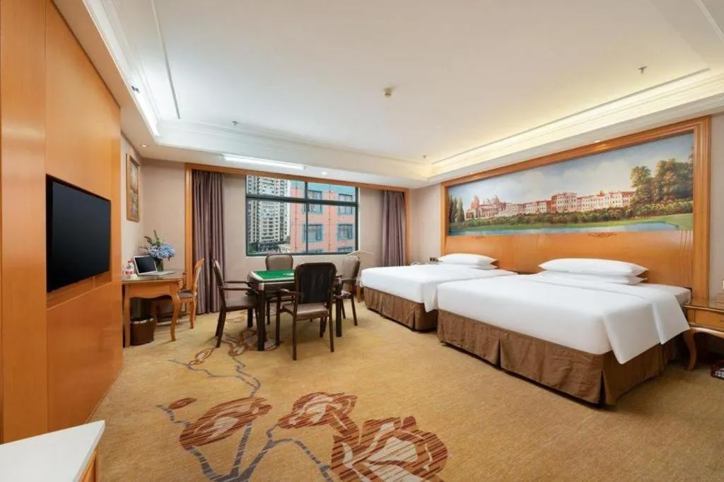 Bed in Vienna Hotel Nanning Anji Wanda 33rd Middle School Metro Station