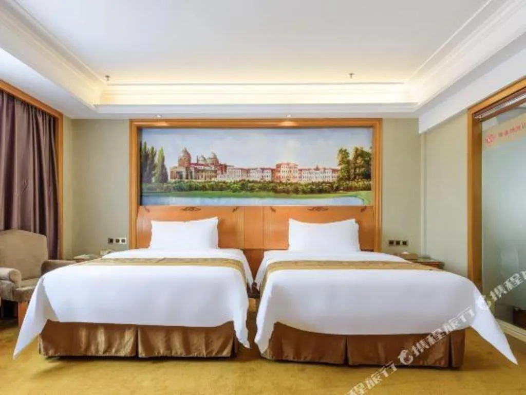 Bed in Vienna Hotel Nanning Anji Wanda 33rd Middle School Metro Station