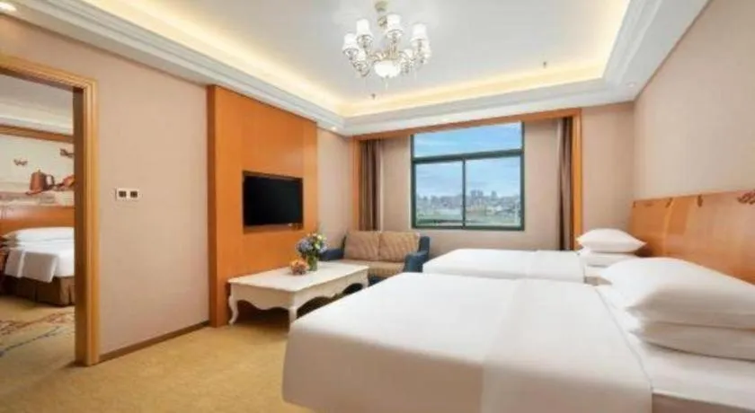 Bed in Vienna Hotel Nanning Anji Wanda 33rd Middle School Metro Station