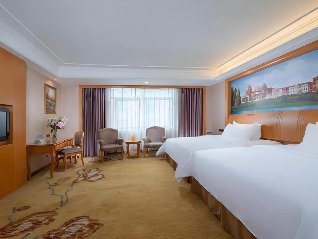 Bed in Vienna Hotel Nanning Anji Wanda 33rd Middle School Metro Station