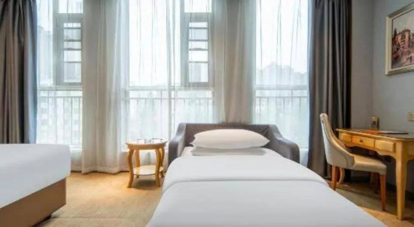 Bed in Vienna Hotel Wuhan Guobo Jiangang Metro Station