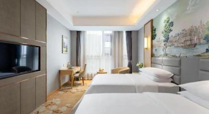 Bed in Vienna Hotel Wuhan Guobo Jiangang Metro Station