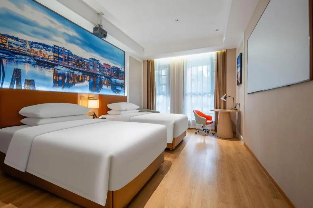 Bed in Vienna Hotel Wuhan Guobo Jiangang Metro Station