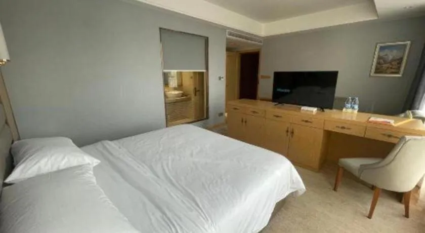 Bed in Vienna Hotel Wuhan Guobo Jiangang Metro Station