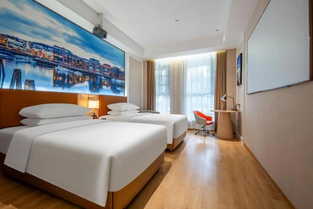 Bed in Vienna Hotel Wuhan Guobo Jiangang Metro Station