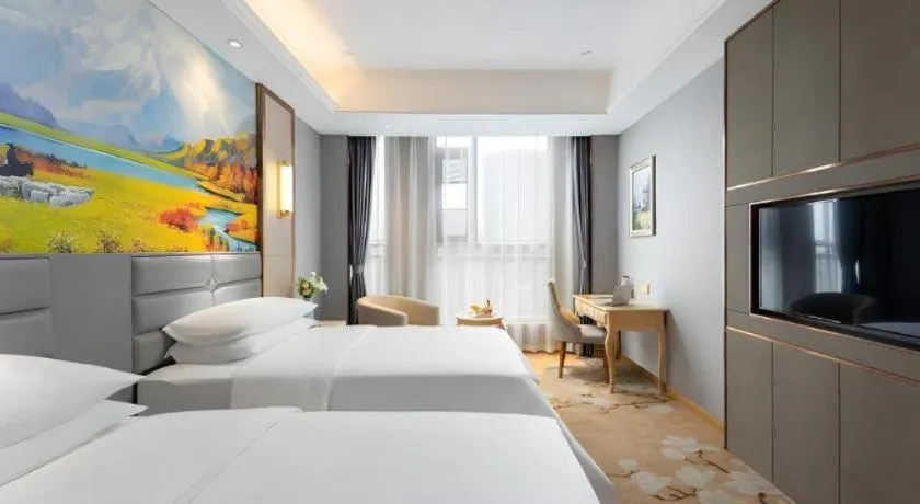 Bed in Vienna Hotel Wuhan Guobo Jiangang Metro Station