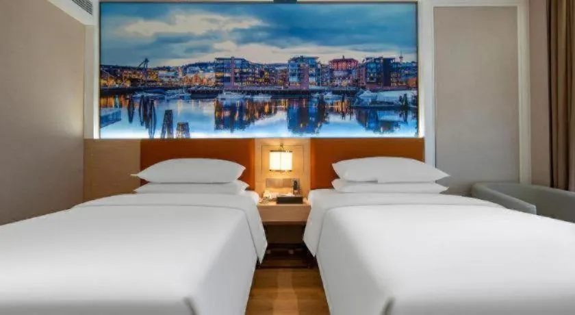 Bed in Vienna Hotel Wuhan Guobo Jiangang Metro Station