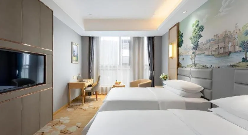 Bed in Vienna Hotel Wuhan Guobo Jiangang Metro Station