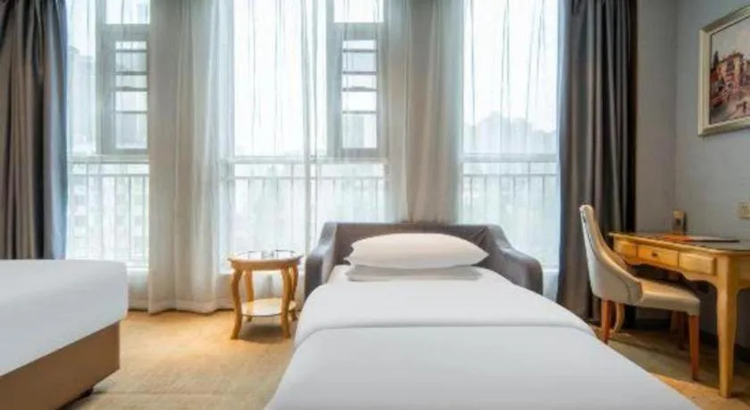 Bed in Vienna Hotel Wuhan Guobo Jiangang Metro Station