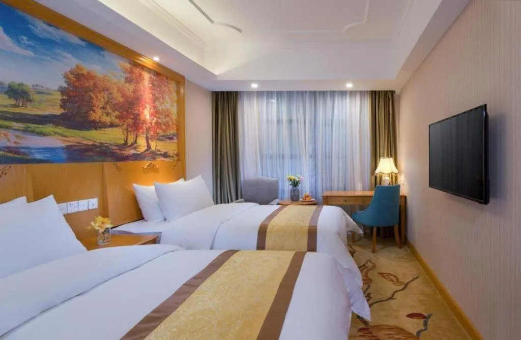 Bed in Vienna Hotel Chongqing Wanzhou Wanda Plaza