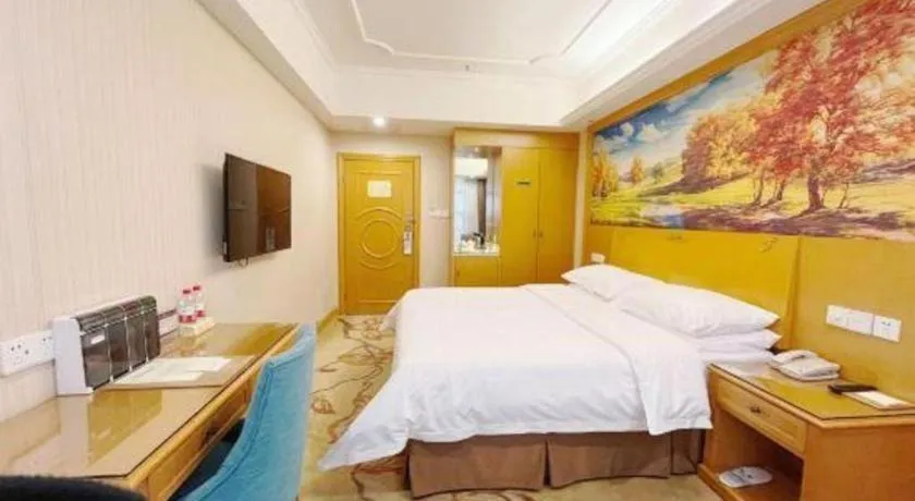 Bed in Vienna Hotel Chongqing Wanzhou Wanda Plaza
