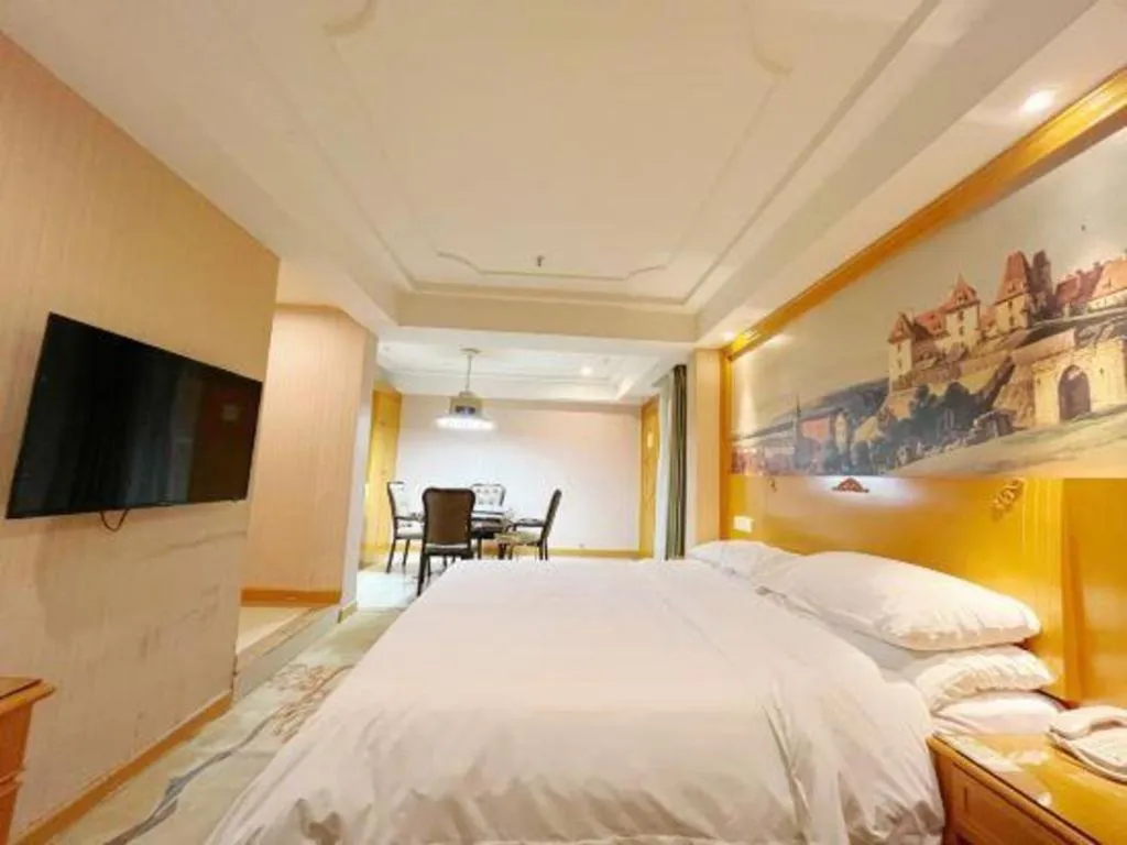Bed in Vienna Hotel Chongqing Wanzhou Wanda Plaza