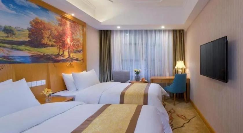 Bed in Vienna Hotel Chongqing Wanzhou Wanda Plaza