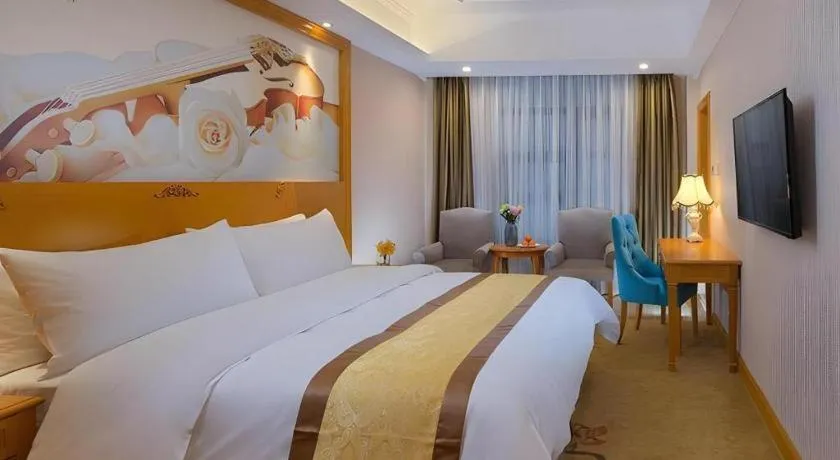 Bed in Vienna Hotel Chongqing Wanzhou Wanda Plaza