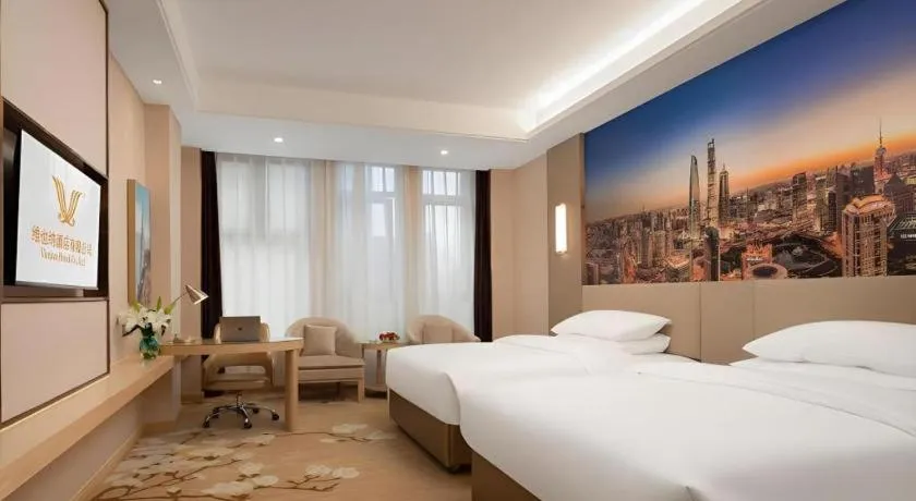 Bed in Vienna Hotel Chongqing Fengdu