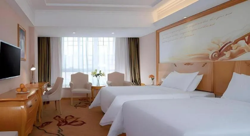 Bed in Vienna Hotel Guangxi Guilin Gongchengtianjie