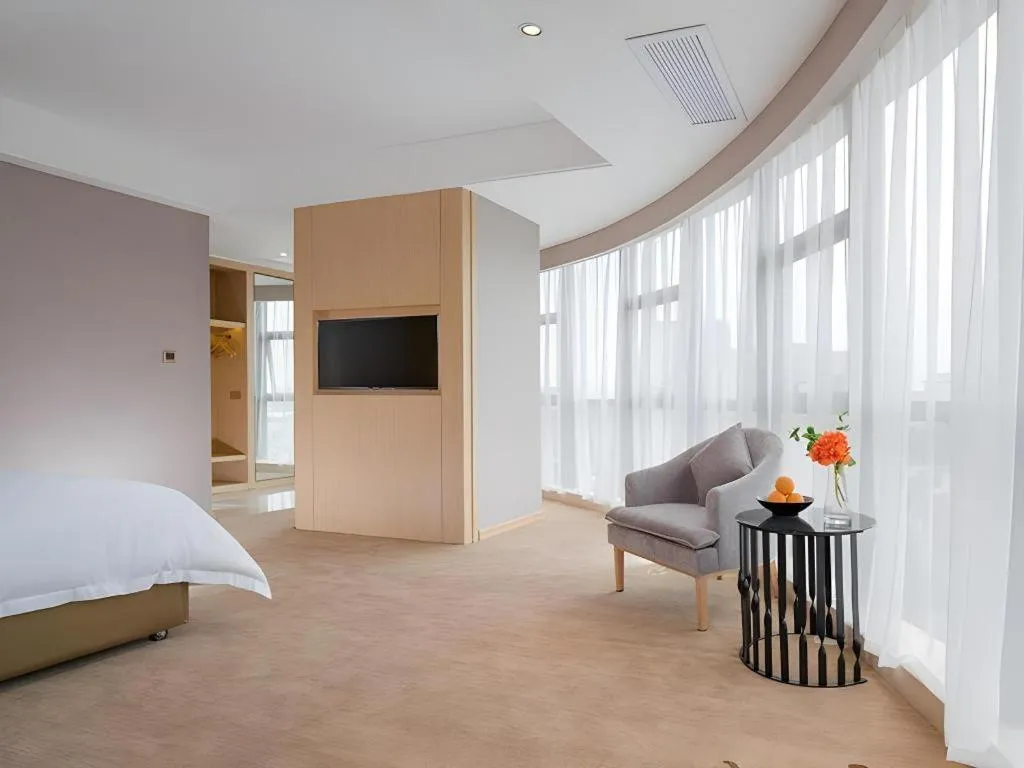 Bed in Vienna Hotel Guangdong Zhongshan Xiaolan High-Speed Railway Station