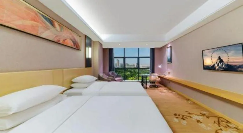 Bed in Vienna Hotel Guangdong Zhongshan Xiaolan High-Speed Railway Station