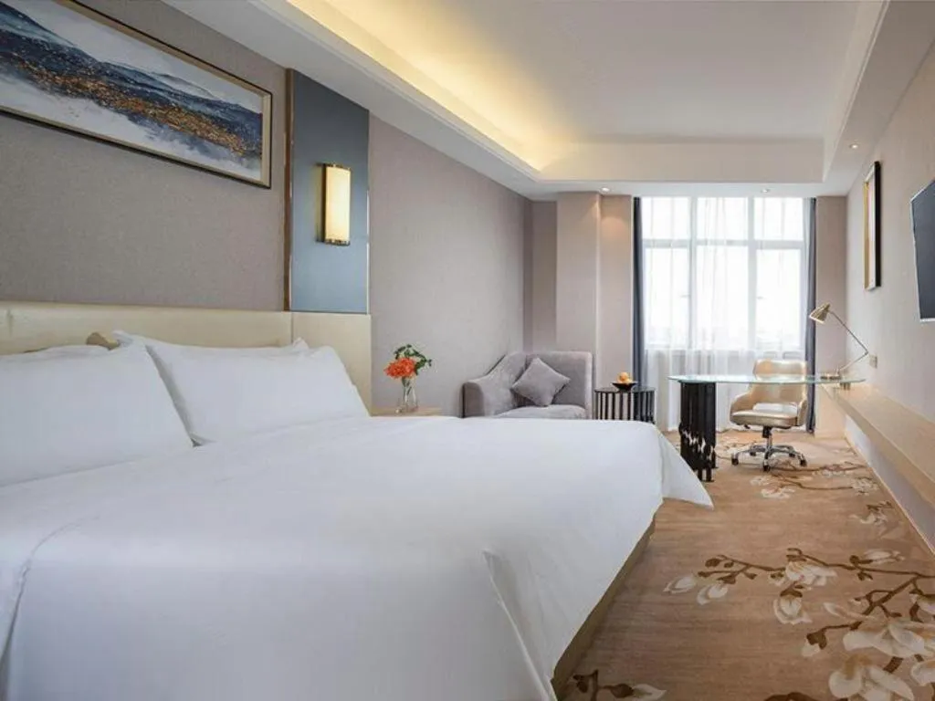 Bed in Vienna Hotel Guangdong Zhongshan Xiaolan High-Speed Railway Station