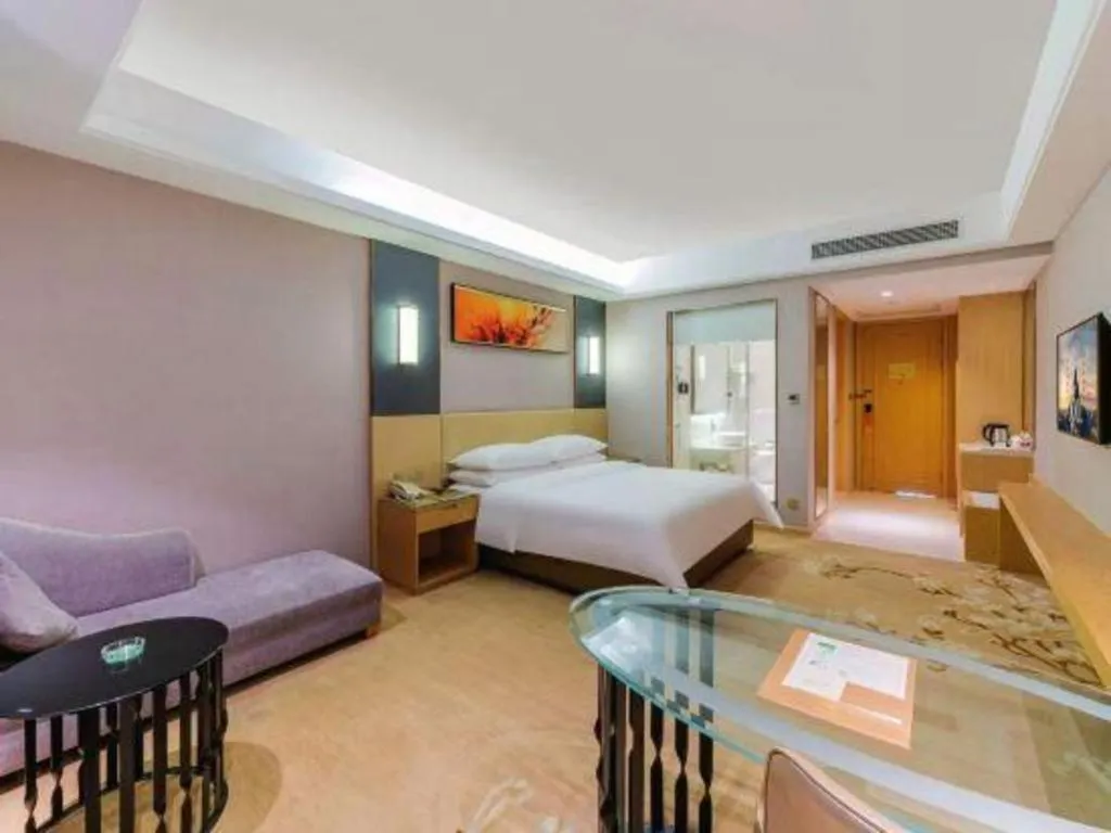 Bed in Vienna Hotel Guangdong Zhongshan Xiaolan High-Speed Railway Station