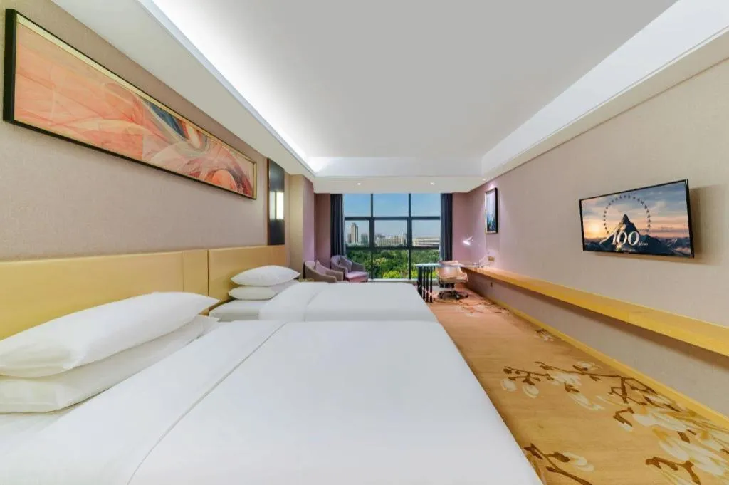 Bed in Vienna Hotel Guangdong Zhongshan Xiaolan High-Speed Railway Station