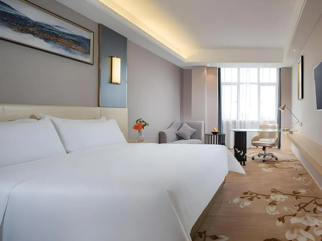 Bed in Vienna Hotel Guangdong Zhongshan Xiaolan High-Speed Railway Station